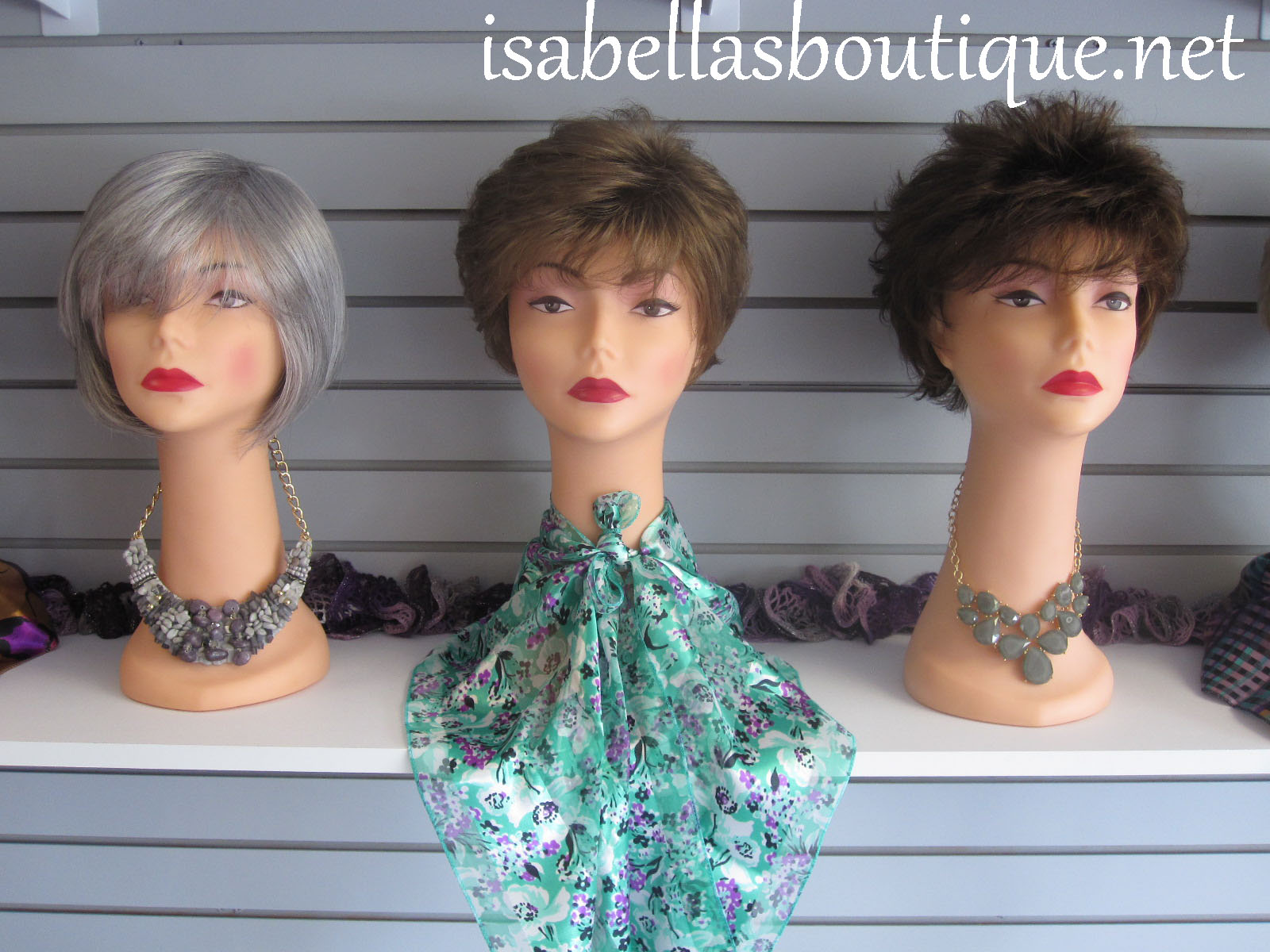 Synthetic wigs displayed at Isabella's Boutique a wig store in the RI area.